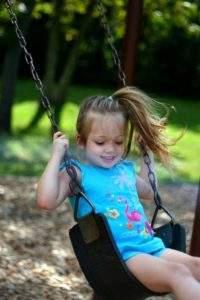 Little girl on a swing Zoe Dow